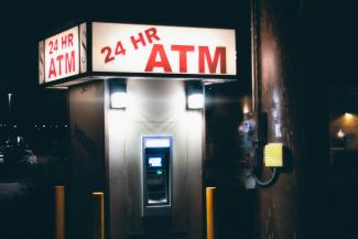 gray and black atm machine by José Reyes courtesy of Unsplash.